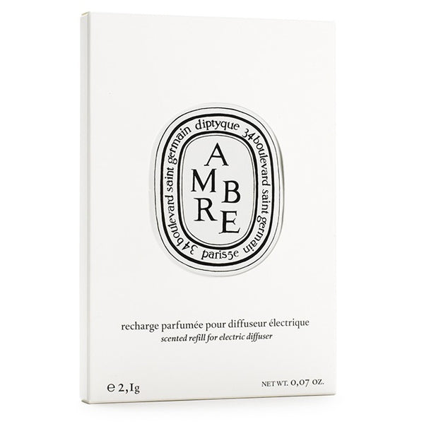 Diptyque - Ambre / Ambra - Capsule in schlichter weißer Verpackung mit klassischem ovalem Logo und eleganter Typografie