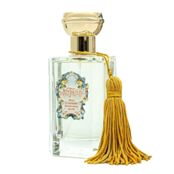 Oriza L. Legrand - Apothéose Flakon mit goldenem Verschluss und dekorativem gelbem Quastenanhänger vor weißem Hintergrund