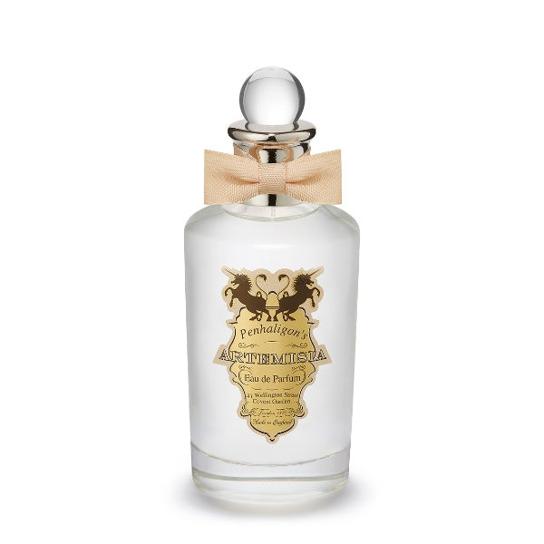 Penhaligon's Artemisia perfume in clear glass bottle with gold label and beige bow on silver neck against white background