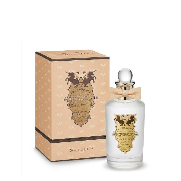 Penhaligon's Artemisia Eau de Parfum bottle with gold label and beige bow beside matching decorative box on white background