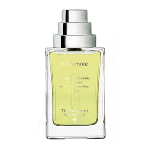 The Different Company - Bergamote eleganter Parfumflakon mit klarem rechteckigem Glas und silberfarbenem Sprühkopf vor weißem Hintergrund