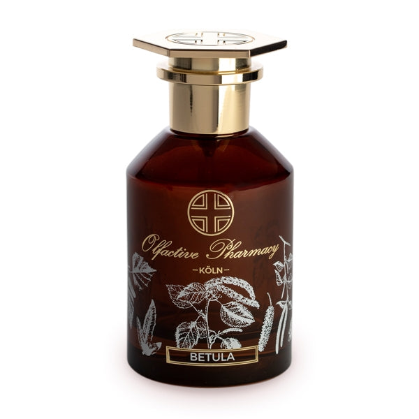 Olfactive Pharmacy - Betula Parfumflakon mit braunem Glas und goldfarbenem Verschluss, verziert mit botanischen Motiven