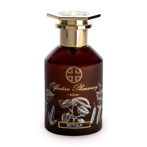 Olfactive Pharmacy - Betula Parfumflakon mit braunem Glas und goldfarbenem Verschluss, verziert mit botanischen Motiven