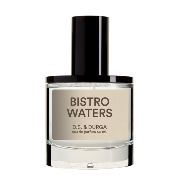 D.S. & Durga - Bistro Waters Parfumflakon mit transparentem Glas und cremefarbenem Etikett vor weißem Hintergrund
