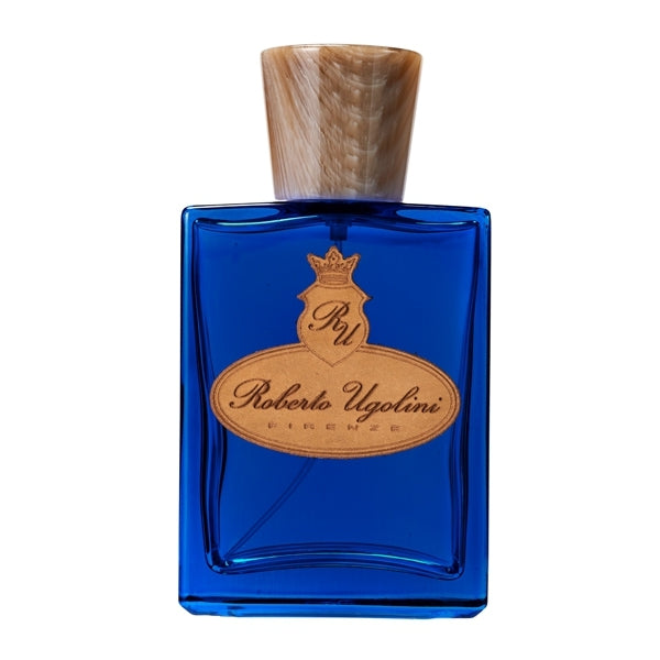 Roberto Ugolini - Blue Suede Shoes Parfumflakon mit tiefblauem Glas und holzfarbenem Verschluss vor weißem Hintergrund