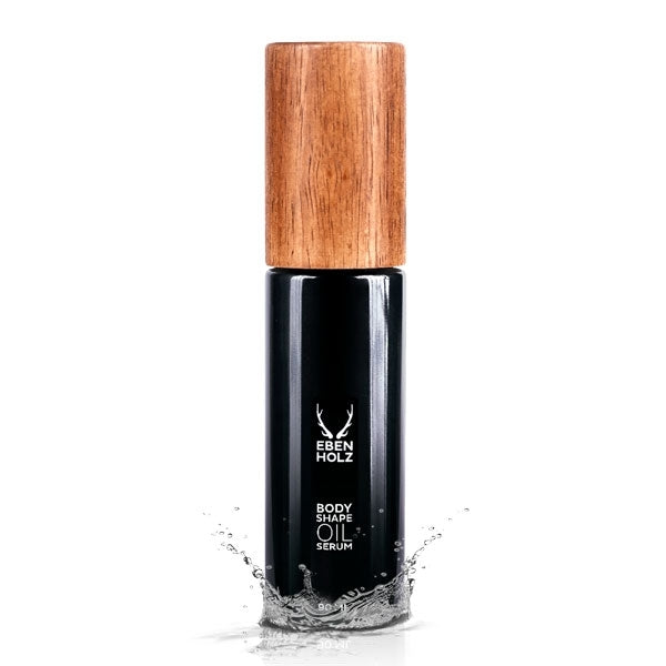 EBENHOLZ - Bodyshape Oil Serum schwarzer Flakon mit Holzdeckel und Wasserspritzern vor weißem Hintergrund