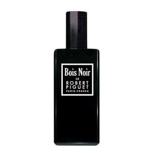 Piguet - Bois Noir zeigt eleganten schwarzen Parfumflakon mit klarer weißer Beschriftung minimalistisch gestaltet