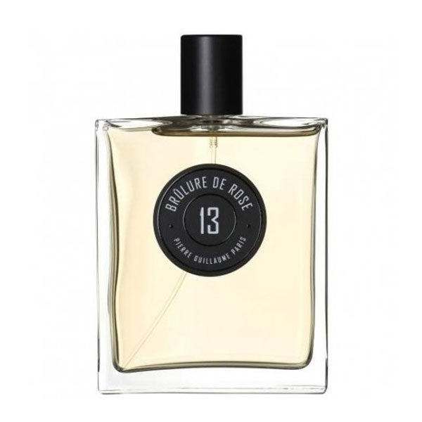 Pierre Guillaume - Brûlure de Rose No.13 Parfumflakon mit klarem Glas und schwarzem rundem Etikett vor weißem Hintergrund