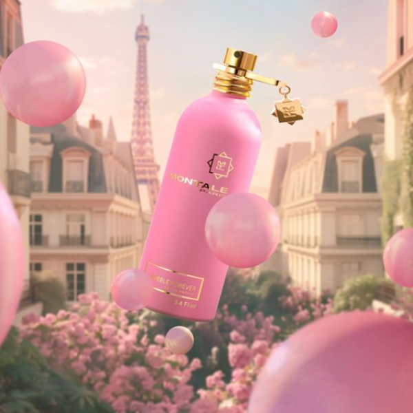Montale - Bubble Forever Parfumflakon in intensivem Rosa mit goldenen Details vor romantischem Stadtbild mit Eiffelturm