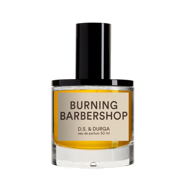 D.S. & Durga - Burning Barbershop Parfümflakon mit schwarzem Verschluss und orangefarbenem Inhalt vor weißem Hintergrund