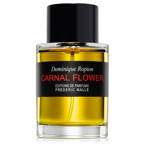 Frédéric Malle - Carnal Flower Parfumflakon mit schwarzem Verschluss und intensiv gelber Flüssigkeit vor weißem Hintergrund