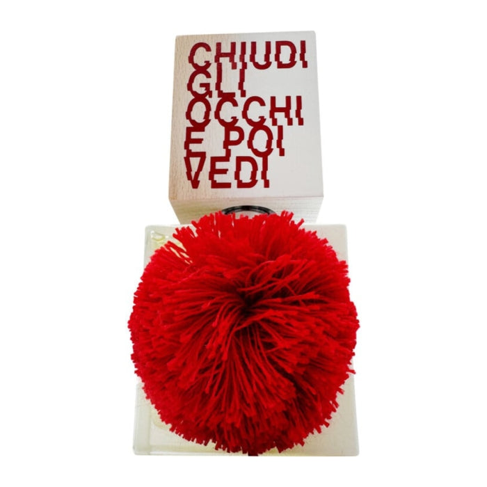 Filippo Sorcinelli - Unum - chiudi gli occhi e poi vedi Parfumflakon mit auffälliger roter Troddel und weißem Deckel mit roter Schrift