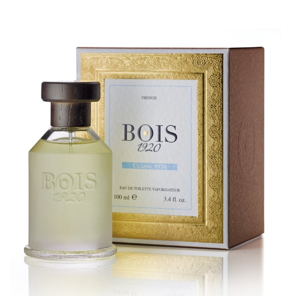 Bois 1920 - Classic 1920 Parfumflakon mit mattem Glas und dunklem Holzverschluss vor edler goldener Verpackung
