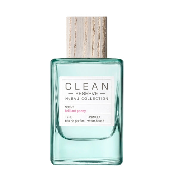Clean Perfume - H2Eau Brilliant Peony Parfümflakon mit grünlichem Glas und Holzverschluss vor weißem Hintergrund