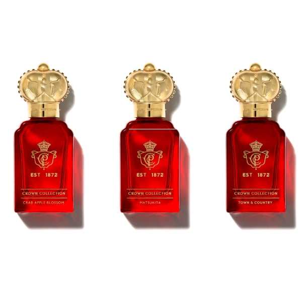 Clive Christian - Crown Collection Traveller Set mit drei roten Flakons und goldenen Kronenverschlüssen auf weißem Hintergrund