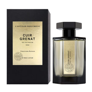 L'Artisan Parfumeur - Les Merveilles - Cuir Grenat zeigt Flakon mit schwarzem Deckel und edler Verpackung elegant präsentiert