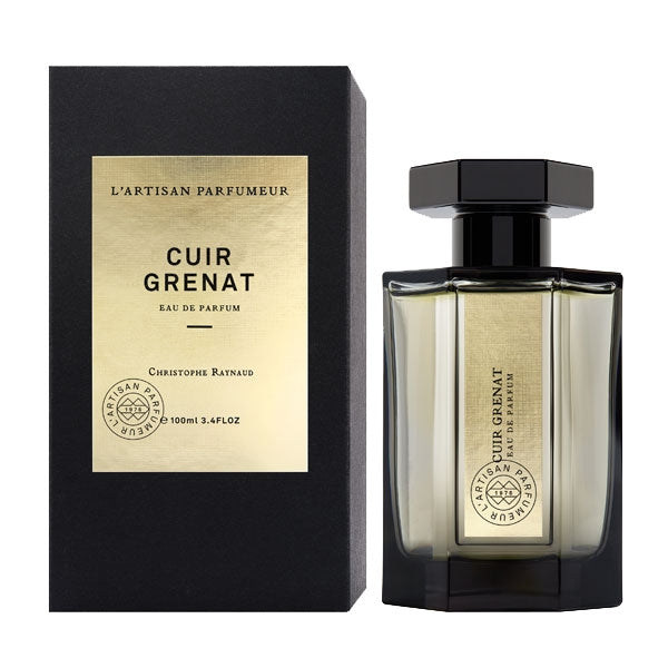 L'Artisan Parfumeur - Les Merveilles - Cuir Grenat zeigt Flakon mit schwarzem Deckel und edler Verpackung elegant präsentiert