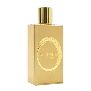 Accendis - The Golds - Cuoredoro rechteckiger goldener Flakon mit rundem Ornament und geriffeltem Verschluss vor weißem Hintergrund