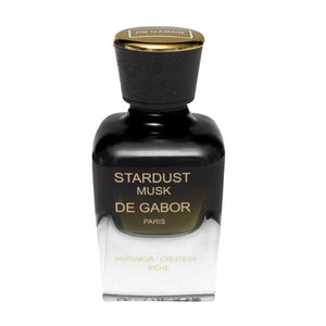 De Gabor - Stardust Musk präsentiert einen eleganten Flakon mit schwarzem Glas und goldfarbenem Verschluss in moderner Form