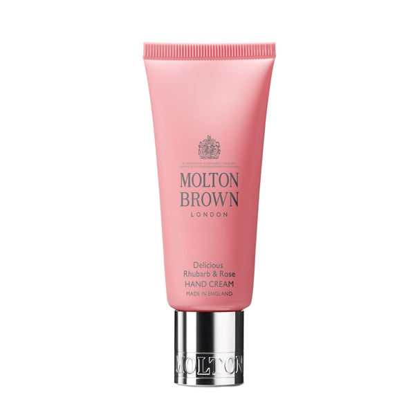 Molton Brown - Delicious Rhubarb & Rose - Hand Cream in rosa Tube mit silbernem Verschluss vor weißem Hintergrund
