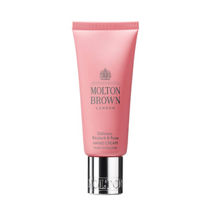 Molton Brown - Delicious Rhubarb & Rose - Hand Cream in rosa Tube mit silbernem Verschluss vor weißem Hintergrund
