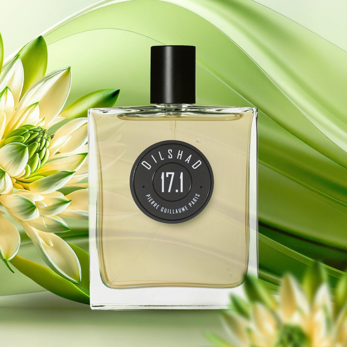 Pierre Guillaume - Dilshad No.17.1 Parfumflakon mit klarem Inhalt und schwarzem Verschluss vor stilvollem grünem Blumenmotiv
