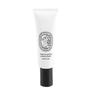 Diptyque - Do Son - Hand Cream in schlanker weißer Tube mit schwarzem Verschluss vor weißem Hintergrund