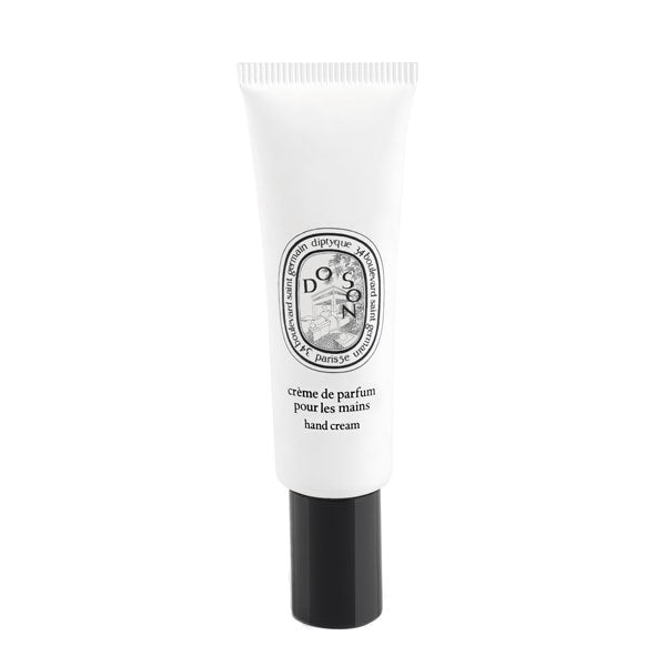 Diptyque - Do Son - Hand Cream in schlanker weißer Tube mit schwarzem Verschluss vor weißem Hintergrund