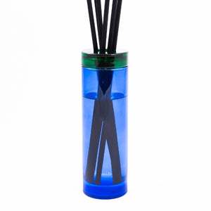 Paul Smith - Early Bird - Diffusor mit blauem Glasflakon, grünem Verschluss und schwarzen Duftstäbchen für frische Raumdüfte