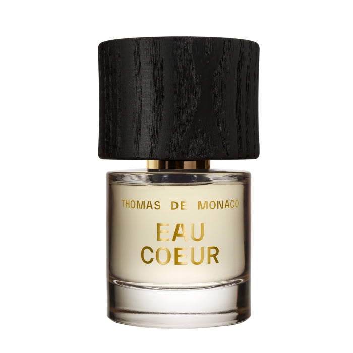 Thomas de Monaco - Eau Coeur Parfumflakon mit goldener Schrift und schwarzem Holzdeckel auf weißem Hintergrund