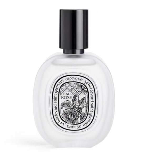 Diptyque - Eau Rose - Hair Mist in transparentem mattiertem Flakon mit schwarzem Sprühkopf und floralem Etikett