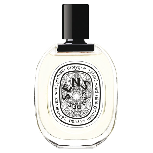 Diptyque - Eau des Sens Parfumflakon mit schwarzem Verschluss und filigranem Blumenetikett vor weißem Hintergrund