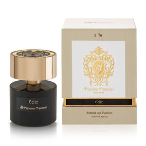Tiziana Terenzi - Eclix Parfumflakon in schwarzem Glas mit goldfarbenem Deckel neben eleganter beigefarbener Box