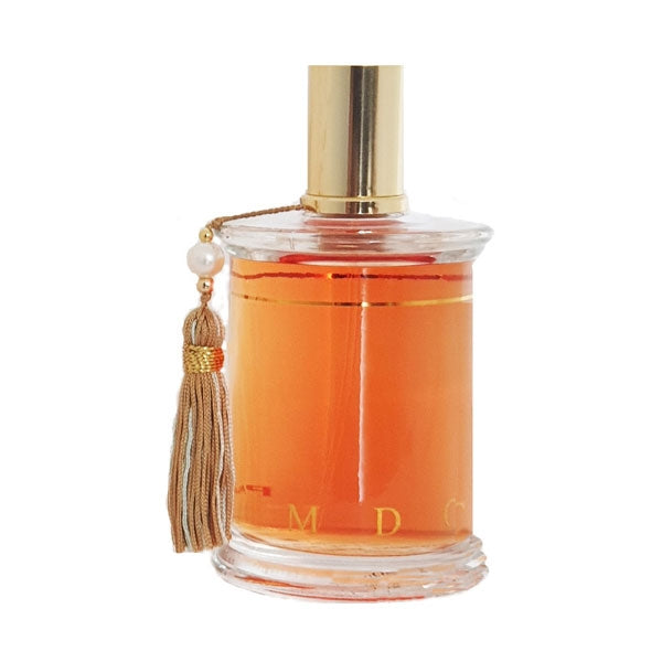 Parfums MDCI Paris - Enlèvement au Sérail Parfumflakon mit goldfarbenem Verschluss und dekorativer Quaste vor weißem Hintergrund