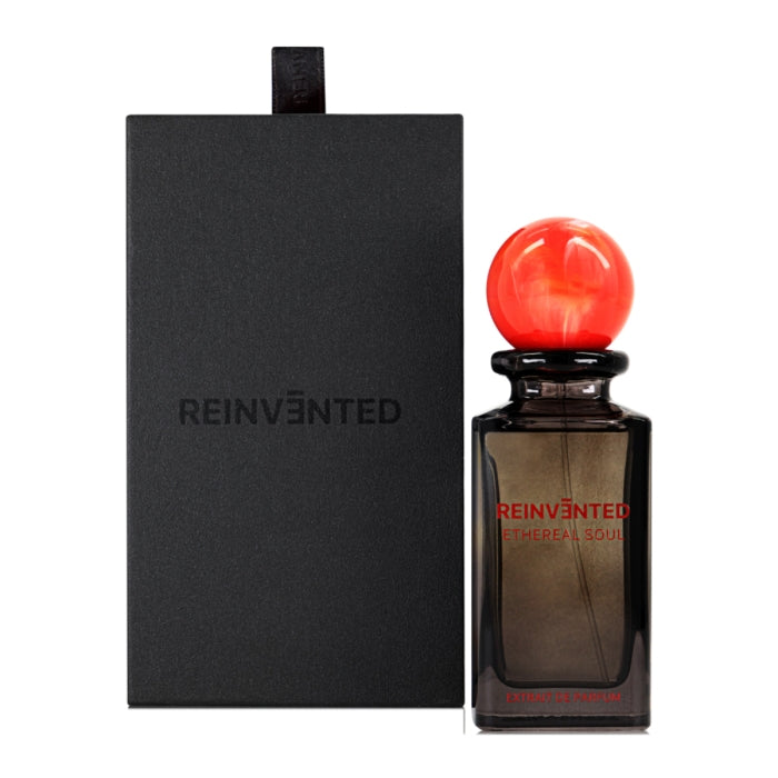 Reinvented Parfums - Ethereal Soul Parfum mit rauchigem Flakon und markanter oranger Kugelkappe neben schwarzer Verpackung
