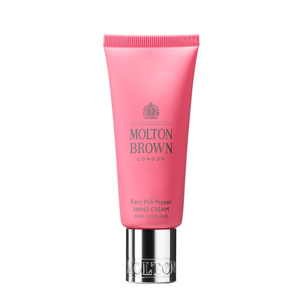 Molton Brown - Fiery Pink Pepper - Hand Cream in pinker Tube mit silbernem Verschluss auf weißem Hintergrund