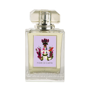 Carthusia - Fiori di Capri Parfumflakon mit klarem Glas und kunstvollem floralen Emblem auf zart lilafarbenem Hintergrund