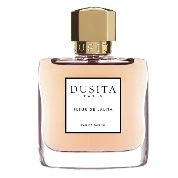 Dusita - Fleur de Lalita Parfumflakon mit cremig-rosafarbenem Inhalt und goldfarbenem Verschluss vor weißem Hintergrund