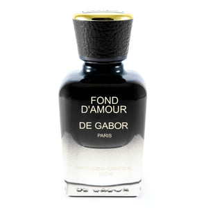 De Gabor - Fond D'Amour Parfumflakon in elegantem Schwarz-Weiß mit goldfarbenem Verschluss auf weißem Hintergrund