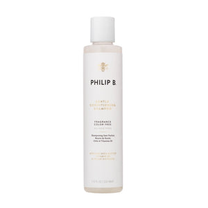 Philip B - Gentle Conditioning Shampoo Flakon in hellem Design mit schwarzer und goldener Schrift vor weißem Hintergrund