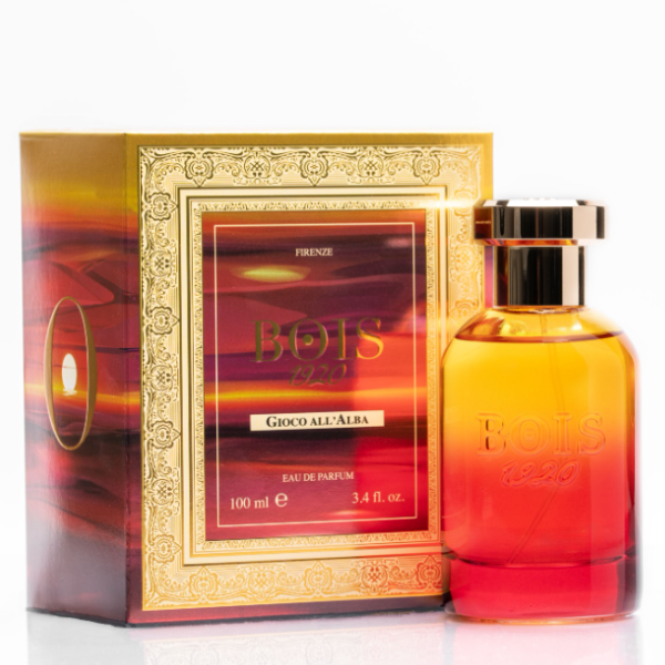 Bois 1920 - Trasparenti - Gioco all’Alba Flakon mit gold-rotem Verlauf und verziertem Etui vor hellem Hintergrund