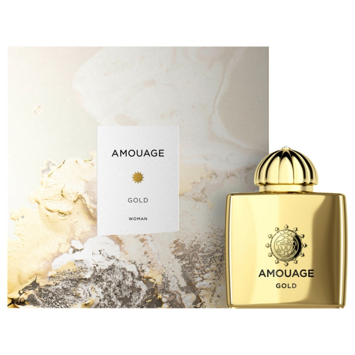 Amouage - Gold Woman luxuriöser Parfümflakon in glänzendem Gold mit eleganter Verpackung vor hellem Hintergrund
