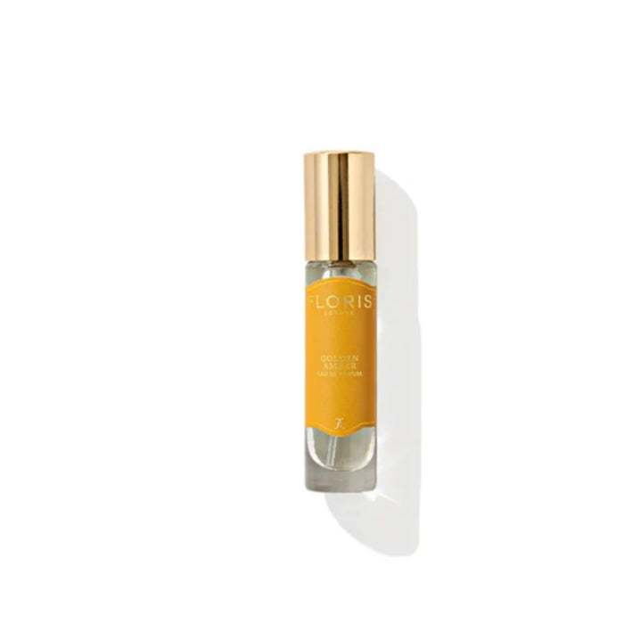 Floris - Golden Amber Roll-On Flakon mit goldenem Verschluss und warmem bernsteinfarbenem Etikett vor weißem Hintergrund