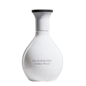 The Harmonist - Golden Wood Parfumflakon in schlichtem, weißem Design mit schwarzem Deckel vor weißem Hintergrund