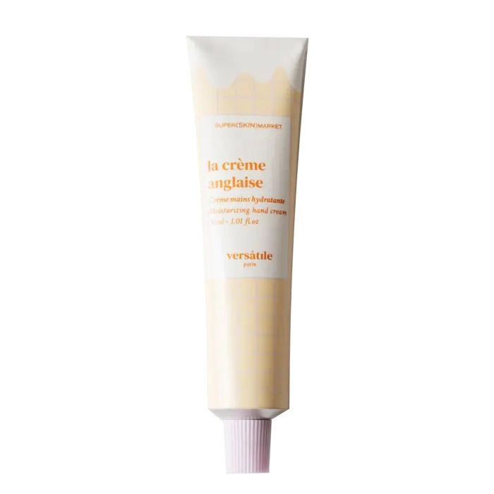 Versatile - La Crème Anglaise - Handcream in schlanker Tube mit cremefarbener Verpackung und orangefarbenem Schriftzug