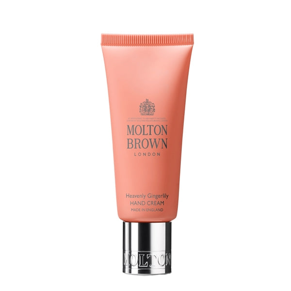 Molton Brown - Heavenly Gingerlily Hand Cream in orangefarbener Tube mit silbernem Verschluss auf weißem Hintergrund