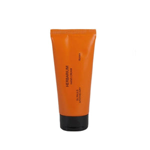 FRAMA - Herbarium - Hand Cream in kompakter oranger Tube mit schwarzem Verschluss vor weißem Hintergrund