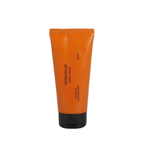 FRAMA - Herbarium - Hand Cream in kompakter oranger Tube mit schwarzem Verschluss vor weißem Hintergrund