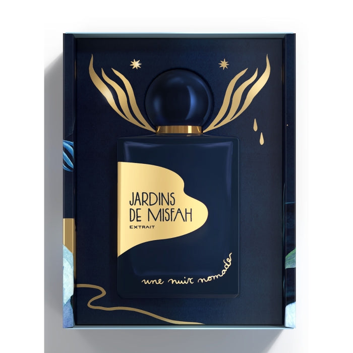 Une Nuit Nomade - Extraits de Voyage - Jardins de Misfah Parfumflakon in eleganter Geschenkbox mit goldenen Details auf tiefblauem Grund