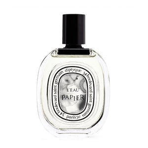 Diptyque - L'Eau Papier Parfümflakon mit klarer Flüssigkeit und schwarzem Verschluss auf weißem Hintergrund